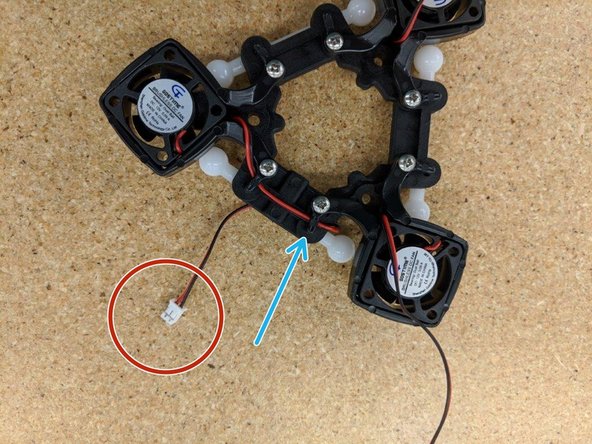 Tighten down the two screws that capture the fan lead you're working with.  Take special care not to crush the fan wire under the clip - make sure it is routed under the clip arch itself.