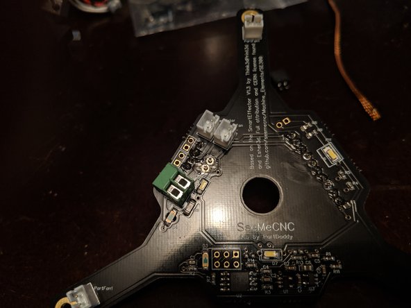 Pic 1 shows the under side of the board with the new plug installed.  You can see the legs of the new power connector sticking through the board.