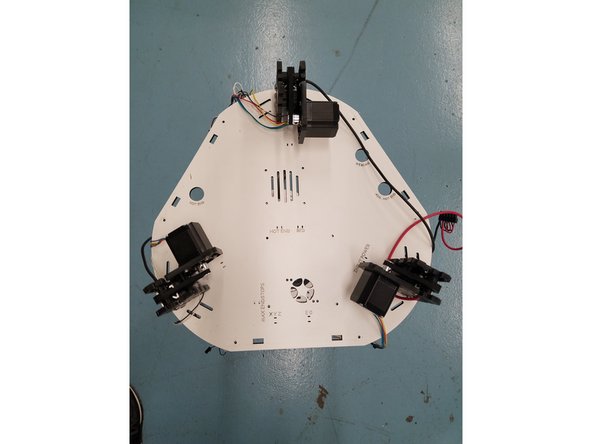 Second, unscrew the 6-32 1&quot;L screws from the injection molded side panels. There will 6 of these screws located on the  bottom of the Laser Cut Panel