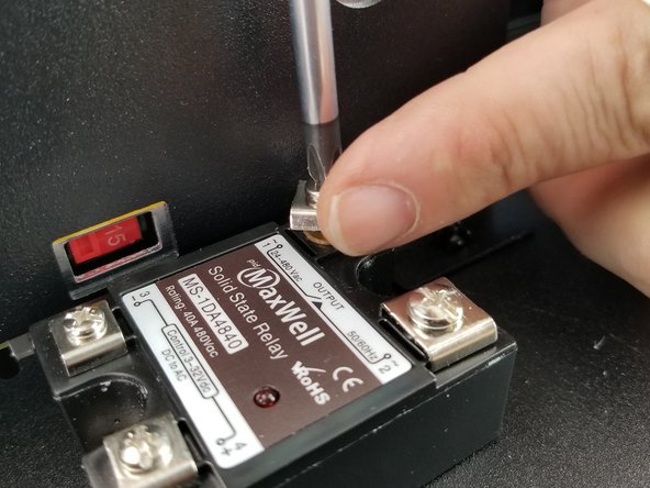 Remove the screw for the output terminal of the next to the power supply.