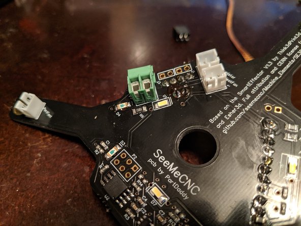 Solder the two legs to the PCB as shown in Pic 2 to secure the power plug in place.