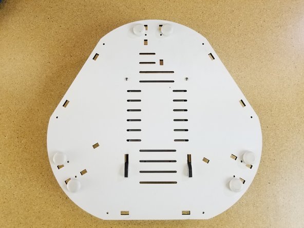 Install the included rubber bumpers on the feet.