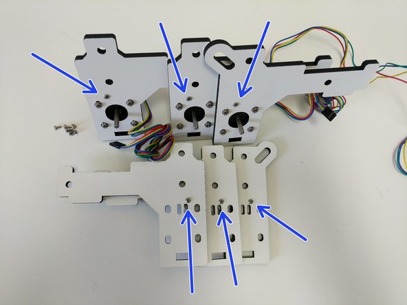 Note the proper location of the screws in the images. The screws should be driven from the side of the pieces that does not have engraved text.