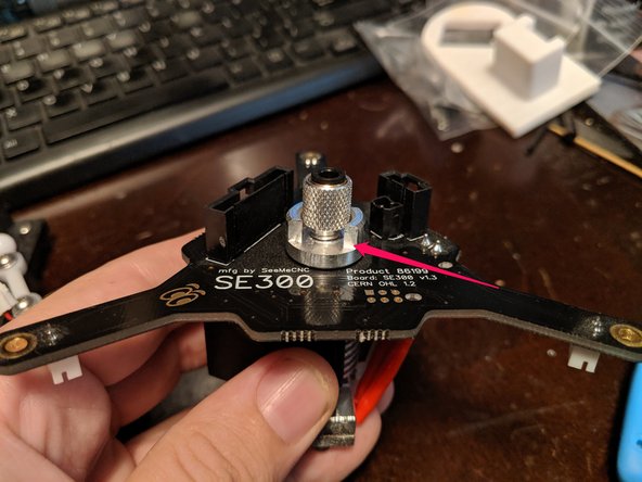 Loosen the locking collar the red arrow is pointing to on the PTC as shown in Pic 1.