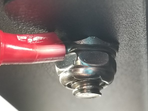 Tighten the lock nut to secure the upper plate and ring terminal to the machine and attach the upper frame to the upper plate.