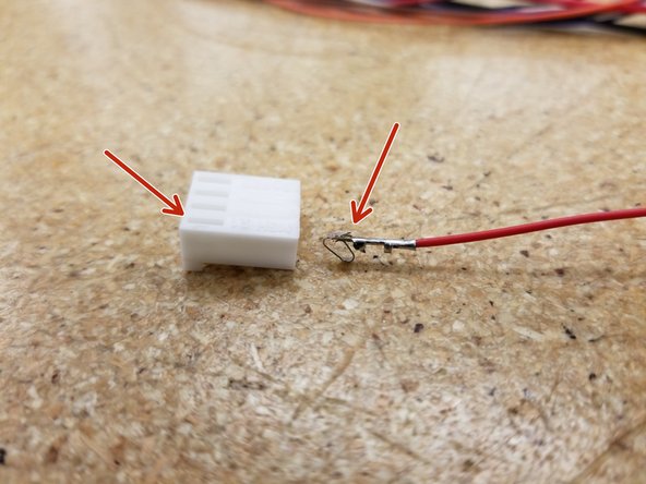 Insert the KK connectors as shown, making sure that the small tab on the metal wire crimp is aligned with the tab hole on the plastic connector.