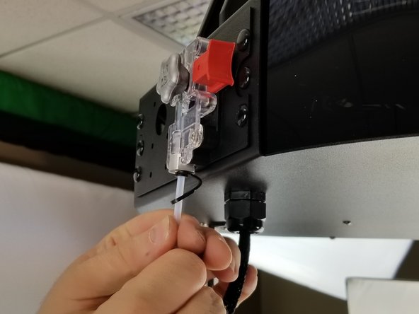 Clip the lanyard to under the black PTC clip on the hotend as you did with the extruder.