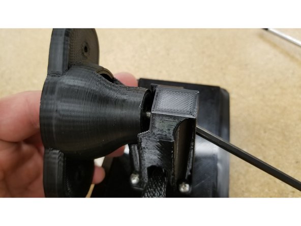 Use the 10-32 x 3/4" L SHCS and the #8 SAE flat washer to secure the two arm parts together as shown.