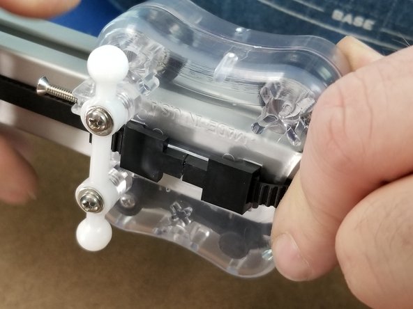 For the lower clamp, pull any slack out of the belt and pull it so it it slightly tight and hold the tension in the belt while inserting the clamp to lock the belt in place.