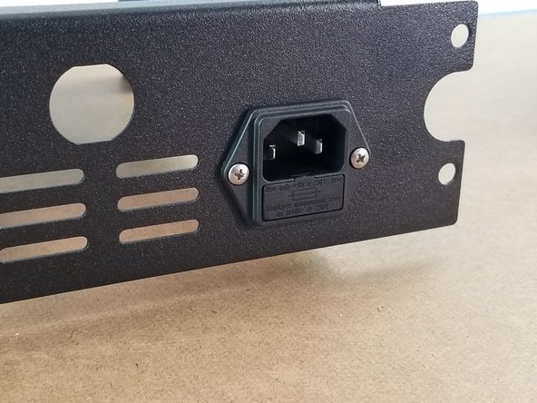 Repeat holding the lock nut with pliers to secure the second screw.