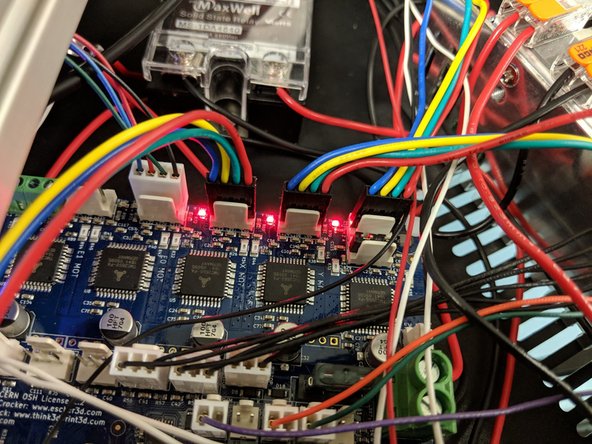 Next connect the Y Stepper motor in the location  indicated by a red arrow in the image with the blue circle.