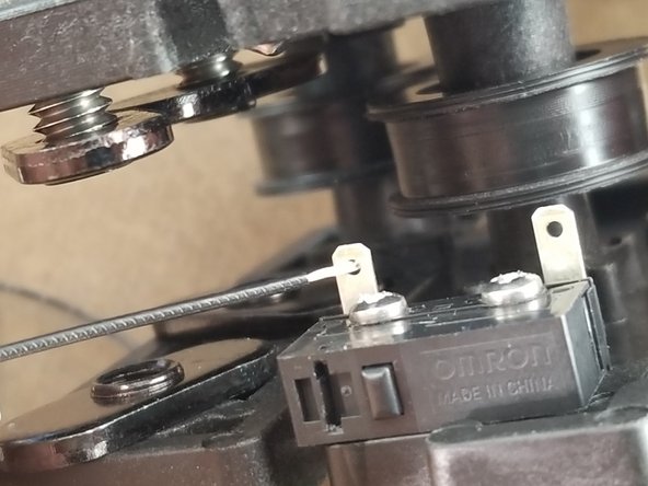 Each pair of wires will be soldered to the endstop legs that are bent out. Insert the stripped end of the wire through the hole on the leg of the endstop and bend in half to hold in place as shown in Pic 3.