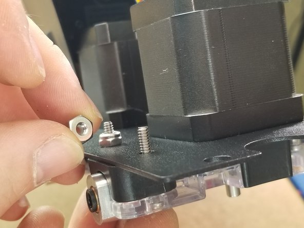 Use the included 30115 6-32 x 7/8&quot;L Phillip Pan Head Screws and 30164 6-32 Nylon Lock Nuts in the locations shown to fasten the extruder in place, just as the existing extruder is.