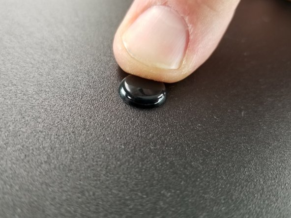 Pres the top of the rivet to lock them into place and secure the power supply bracket to the sheet metal plate.