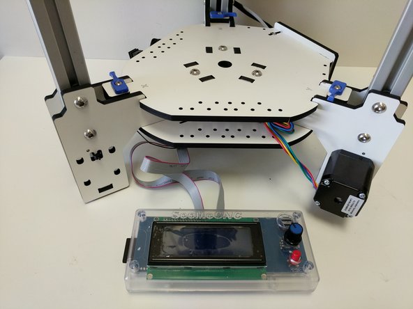 Install the B ribbon cable on the Mini-RAMBo on the 2x5 pin in front of where you just installed the A ribbon cable. The red stripe should be closest to the fuses.