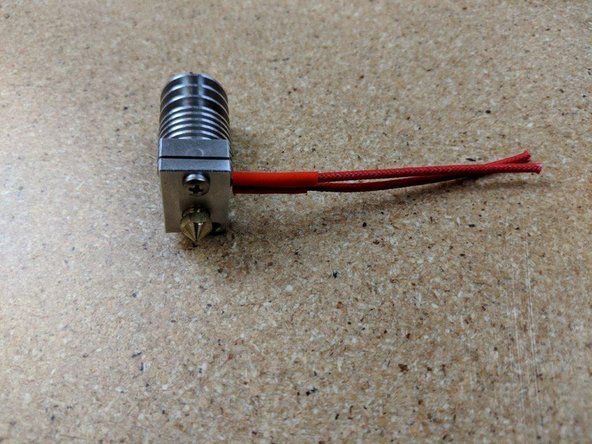 Insert the heater cartridge into the heater block.  The wires from the heater cartridge should exit the same side the set screw is on that holds the thermistor in place.