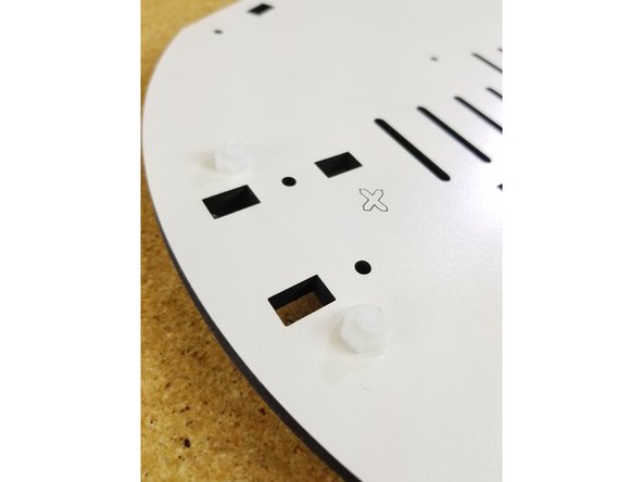 The feet are attached using the included plastic nuts and bolts. These fasteners are packed with the feet.