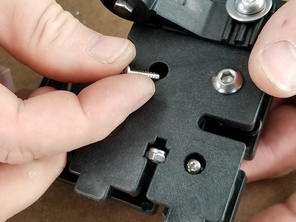 Pics 2 and 3 show the two locations the screws will be inserted.