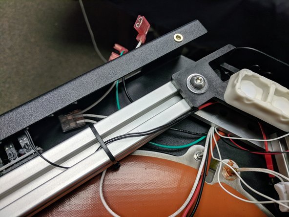 Route the 18awg white, green, and black wires with right angle spade connectors between the T-Slot and the Sheet Metal. and out the rectangular opening in the side of the base assembly.
