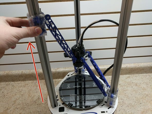 Slowly and carefully raise the carriages, one at a time until they are all three in printing position. Be sure to look at all three images before beginning.