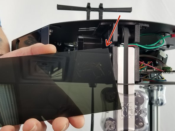 Take 3 of the acrylic corner covers and remove the protective tape.