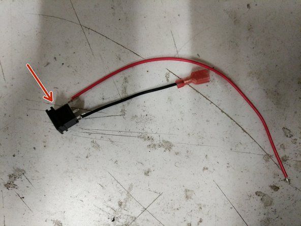 Solder the 18awg short black wire (with spade conector attached) to the bottom of the power jack connector.