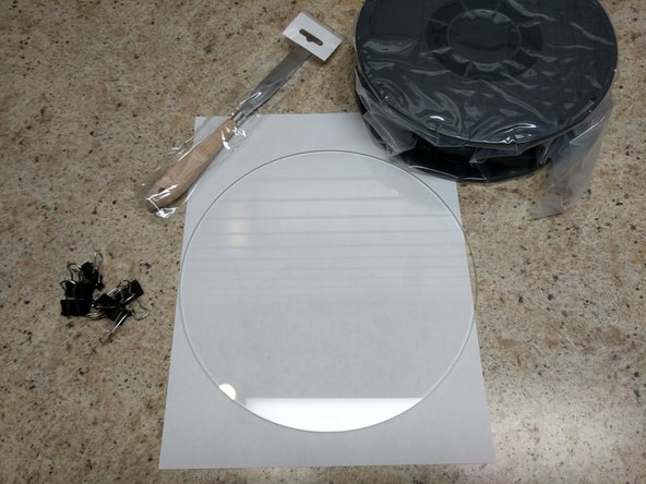 Carefully cut away the shrink wrap holding it all together. Be very careful not to drop the glass plate.