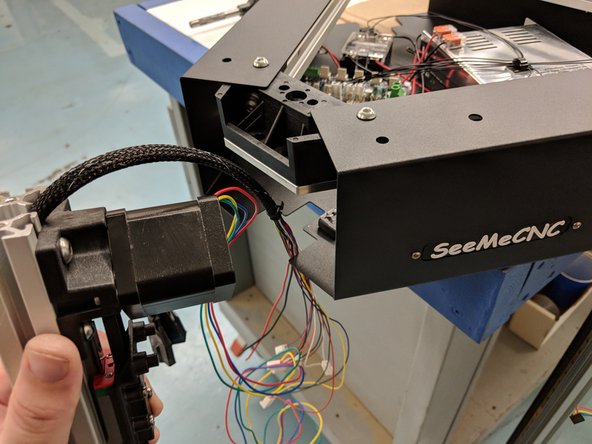 The X Tower will be the first tower to be installed. This tower is the one with the extruder and whip pre-installed. To begin, you will want to elevate the printer's upper assembly so it is up higher than the length of the rail. For our assembly we used the box that the upper assembly came in, or a workbench height table.