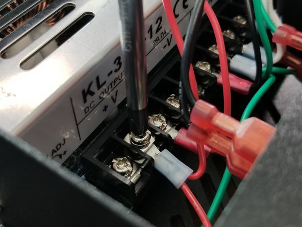 Secure the blue ring terminal to the power supply using the second from the last screw terminal under the label +V on the power supply.