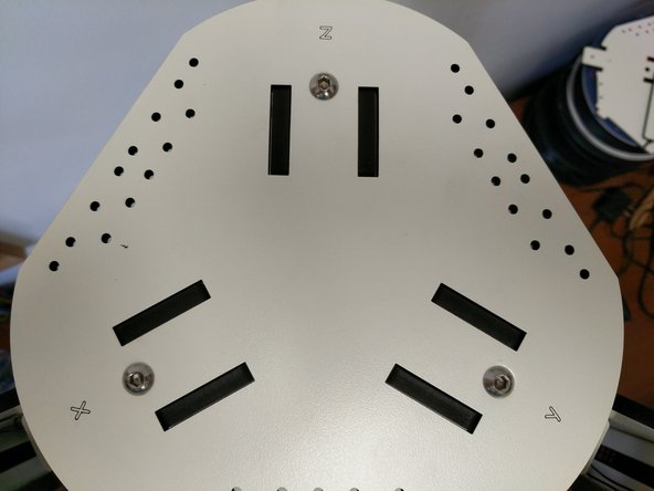 Insert (3) TSLOT nuts into the TSLOT in the top of the printer. Try to align them as shown in the image (to prevent having to move them around too much after the top plate is installed.