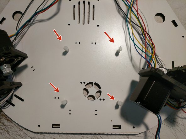 Attach the board supports to the top base plate in the locations shown.