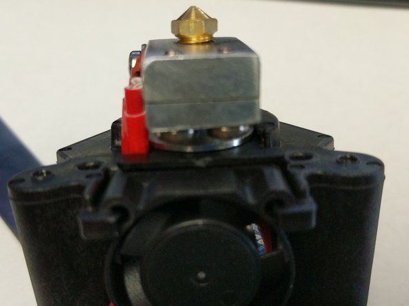 Align the barrel fan blocker with the visible fin on the heat sink between the hot end stand off and the heater block. The blocker is not symmetrical, the side with the skinnier leg will be on the side of the heater cartridge leads.