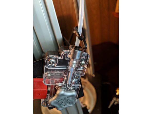 Install the locking clip as you did on the previous step to lock the tube in place.