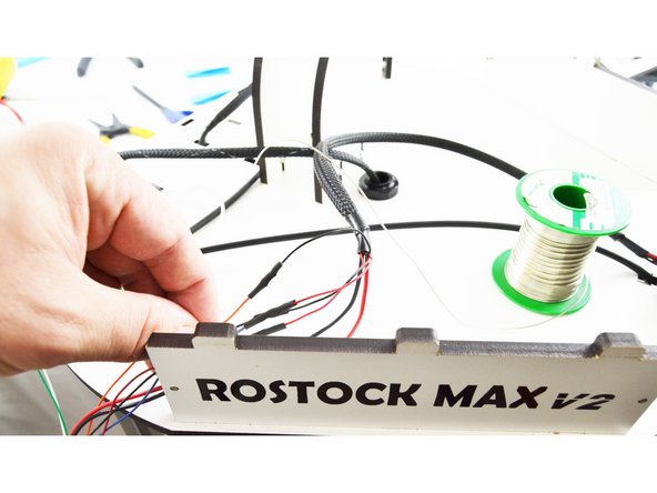 Slide the heat-shrink up over the connection that you soldered and heat it with a lighter.
