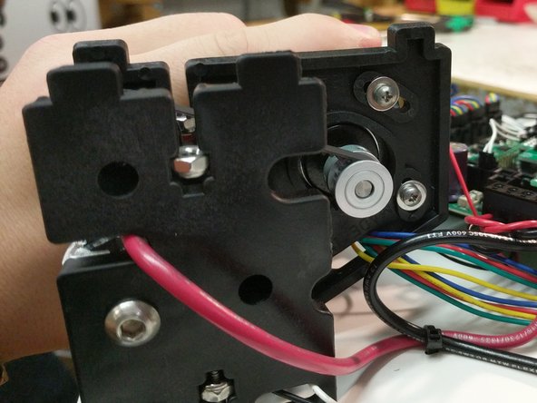 The belts in the Rostock MAX v3 are tensioned by rotating the stepper motor towards the center of the printer.