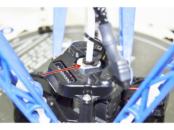Insert the PTC Lanyard onto the black ring in the top of the hotend. This will secure the Bowden (PTFE) Tube and prevent it from being able to work its way out of the hot end.