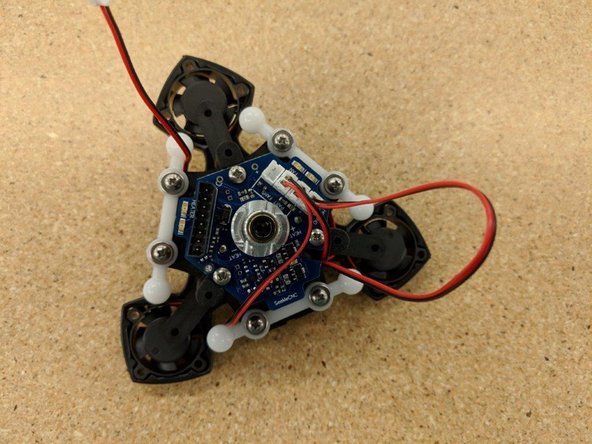 Route the fan leads as shown and plug into the JST connectors at the top of the PCB.