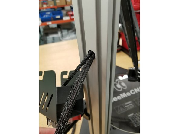 Pull the wires through the tower until the mesh loom enters the hole in the tower and there is enough wire to reach all the connection points in the top assembly when wrapped around the tower.