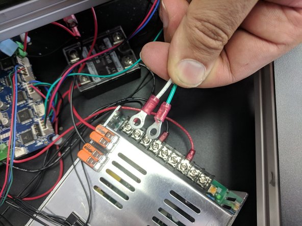 Locate the 18awg green and white wires with ring terminals.