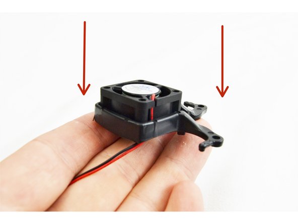 Insert (1) fan into each fan mount as show in the image.