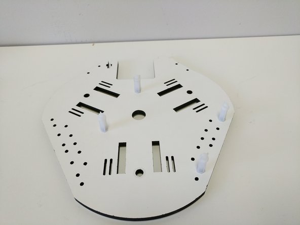 Attach the board supports in the locations shown. Tighten these at this time.