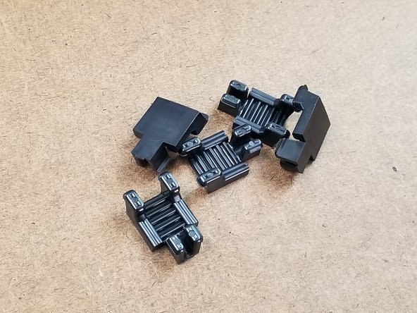 Locate the belt clamps from the carriage pack.  You will use 2 clamps for each carriage.