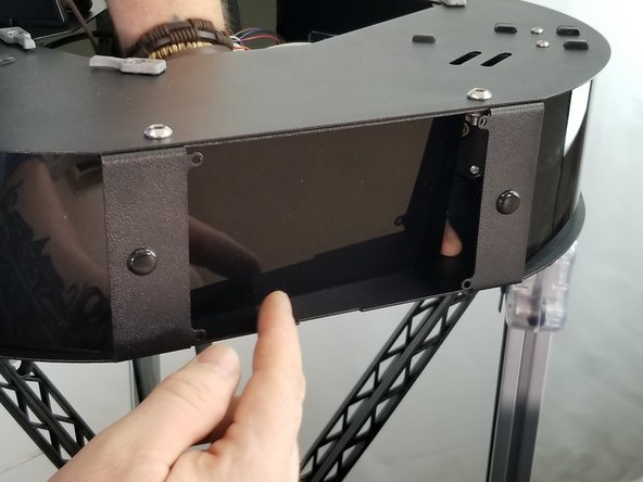 Pop out the touch screen hole cover, pushing inward to release it from where it's seated