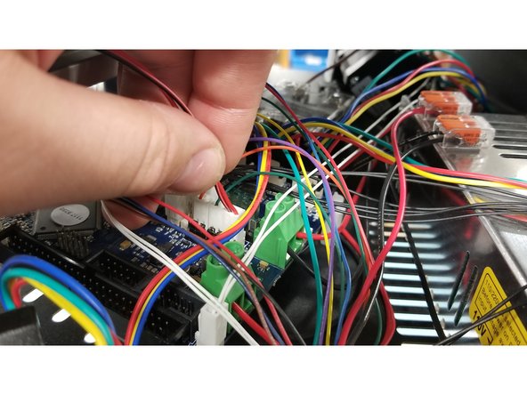 Be sure to take note of the location and unplug the two pin fan connector from the Duet.