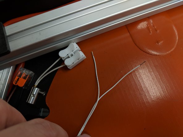 Your final two white 26awg wires exiting the Z tower in the bottom assembly will connect to the white toggle connector as shown.