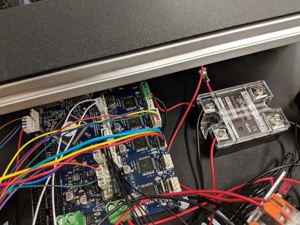 Plug the connector in so that the smooth flat side of the black connector is facing the outer edge of the Duet.