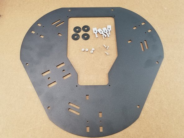 We will now be assembling the top plate. You will need to gather the top sheet metal plate, 4 silver build plate clamps, 4 large 1&quot; od plastic washers, 4x 6-32 x 1/2&quot; long flat head phillips screws, and 4 nylon lock nuts.