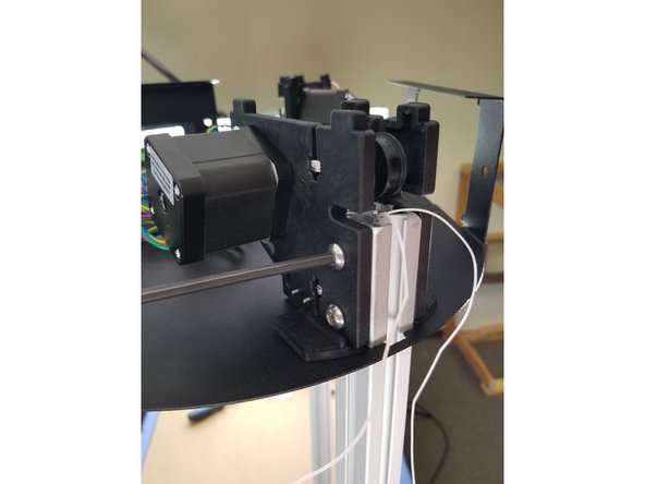 Slide the upper frame all the way down on the brackets.  The end of the extrusion should line up with the notches in the motor brackets as shown in Pic 2.