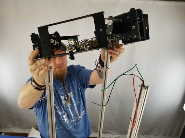 Now you will place the upper frame on the top of the machine.