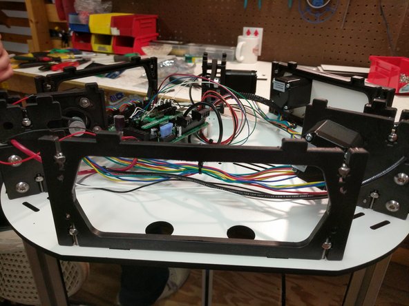 Install the first base side between the X &amp; Y towers.